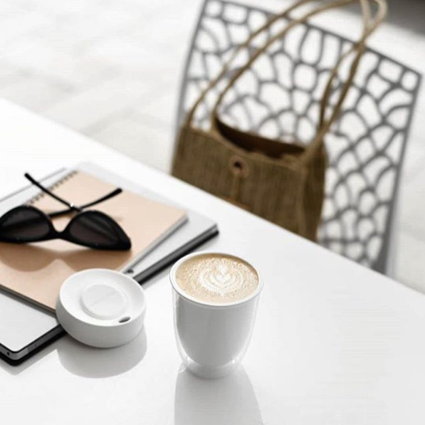 Reusable coffee cup on table